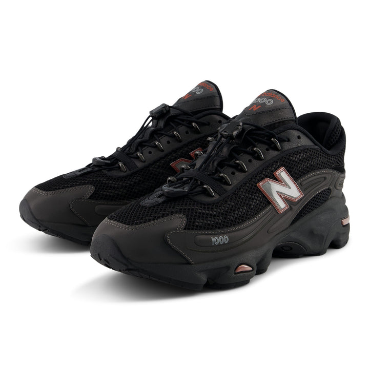NEW BALANCE U100010A BLACK METALLIC/RED ROCK