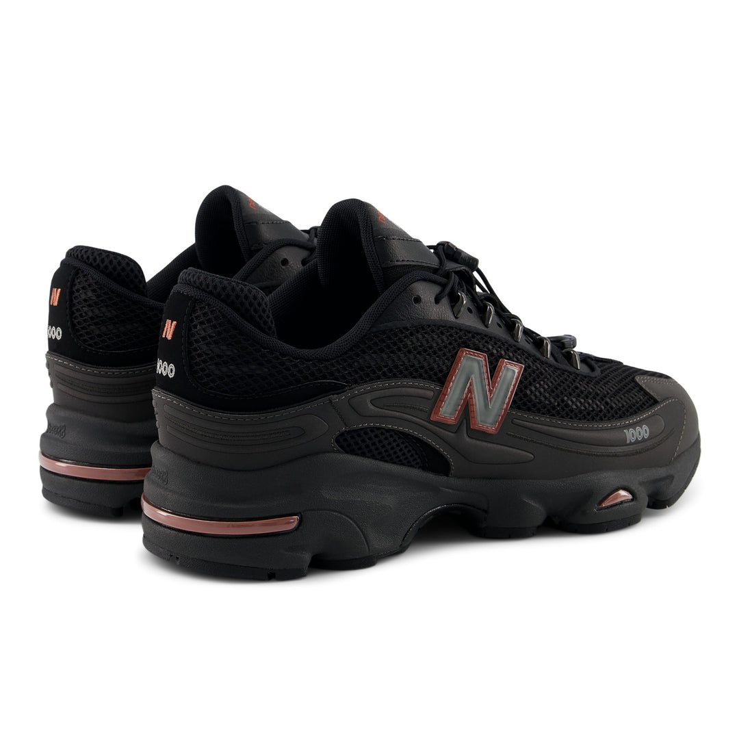 NEW BALANCE U100010A BLACK METALLIC/RED ROCK