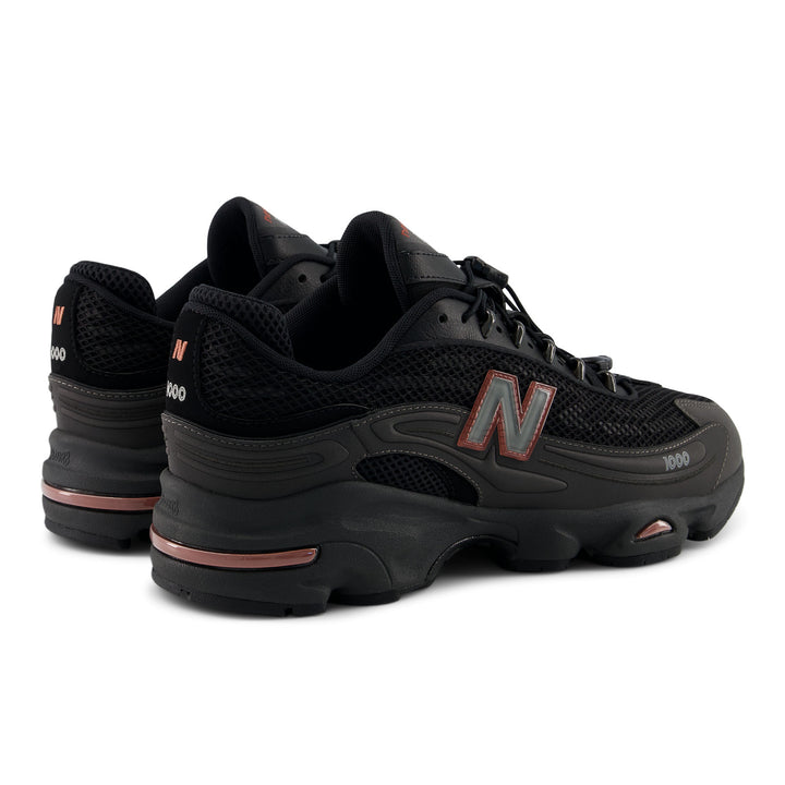 NEW BALANCE U100010A BLACK METALLIC/RED ROCK