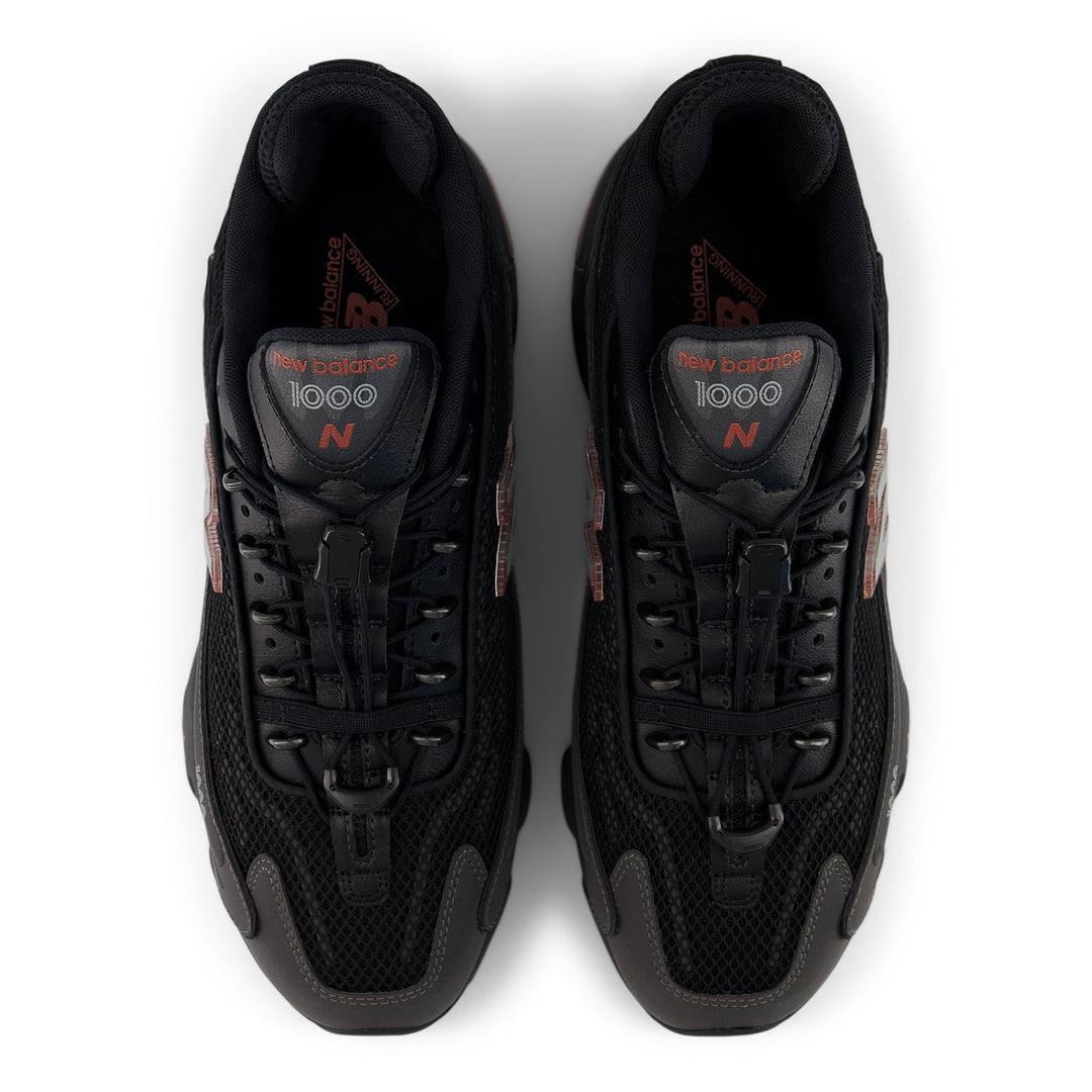 NEW BALANCE U100010A BLACK METALLIC/RED ROCK