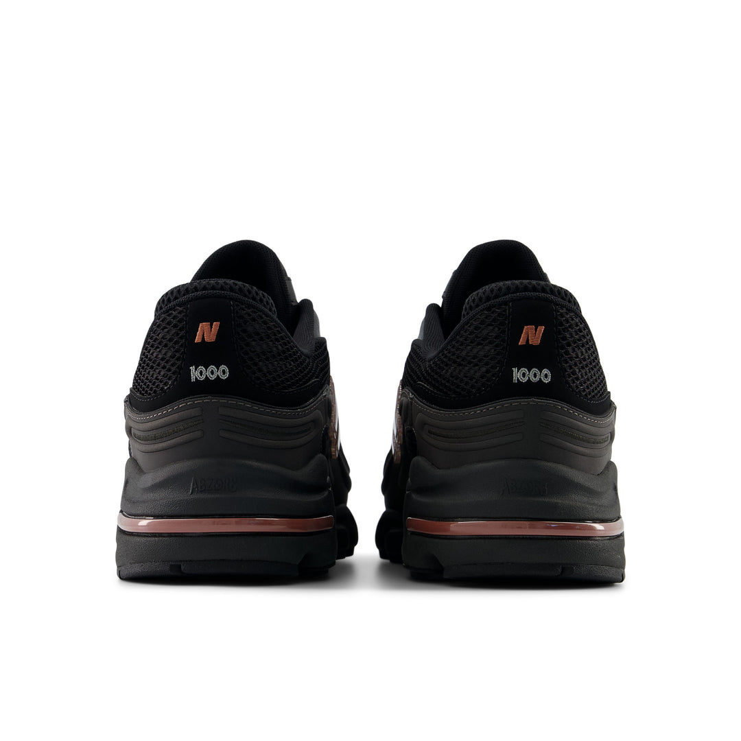NEW BALANCE U100010A BLACK METALLIC/RED ROCK