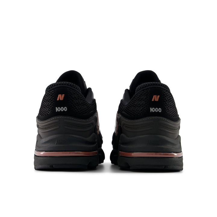 NEW BALANCE U100010A BLACK METALLIC/RED ROCK